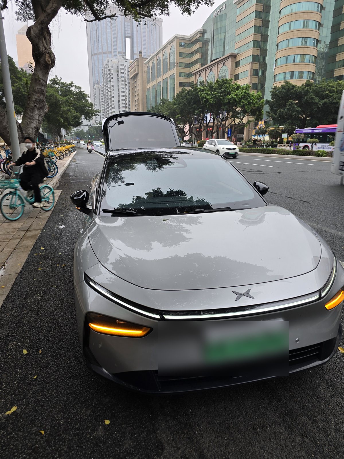 An electric car with a green plate